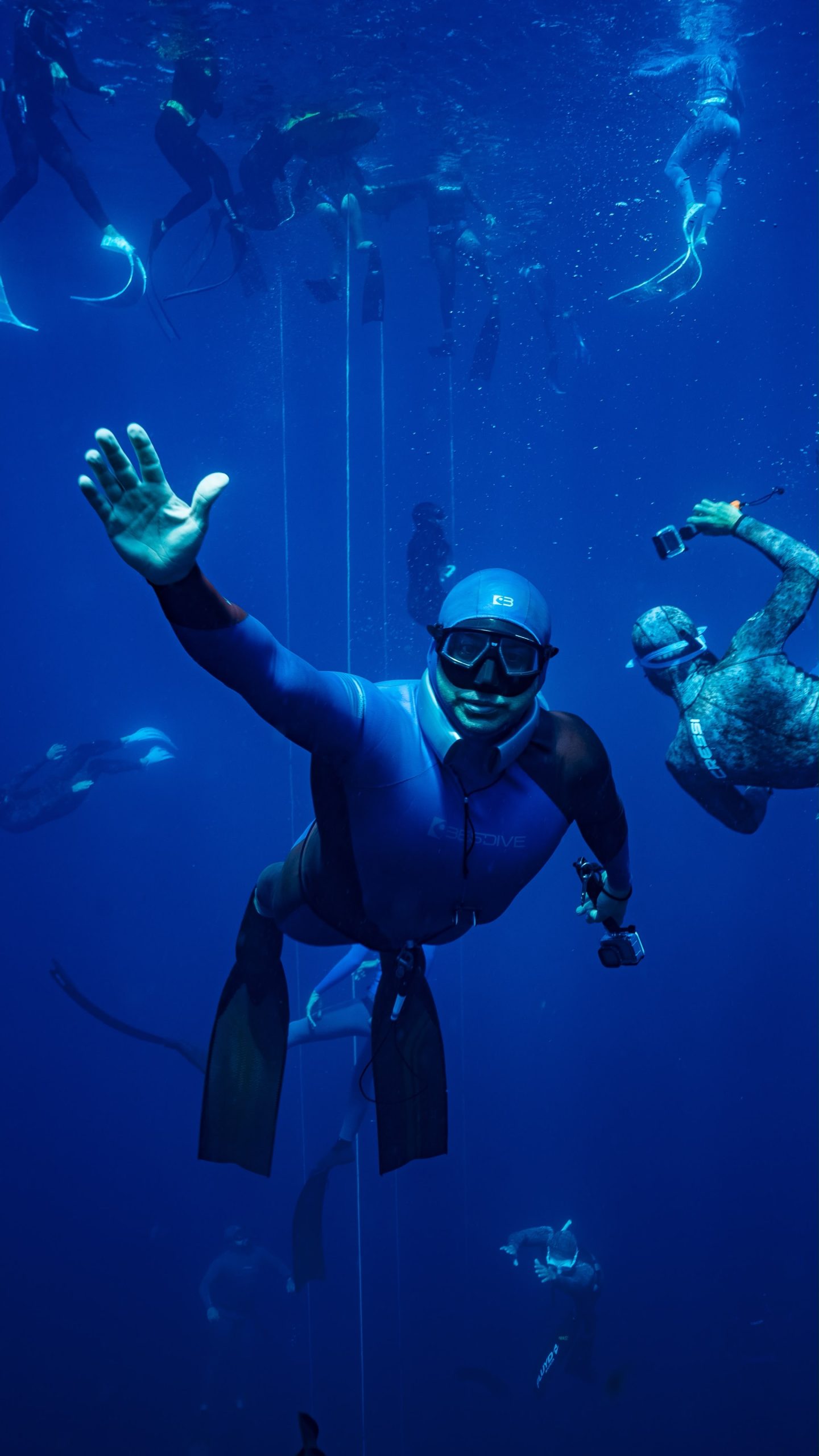 Group freediving session in blue water